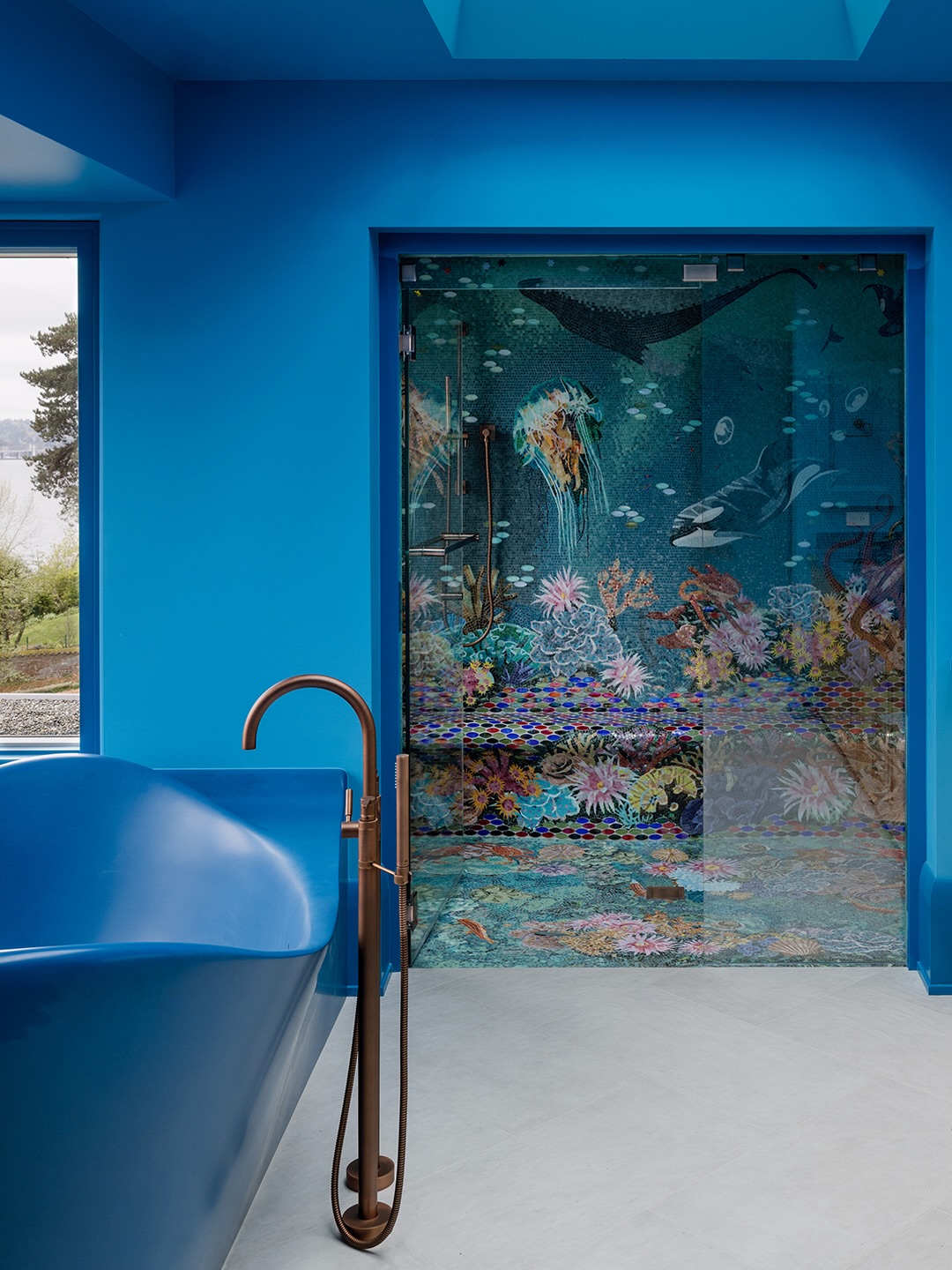 Completed primary bath with bespoke blue freestanding tub and mosaic shower enclosure, Kaleidoscope Haven