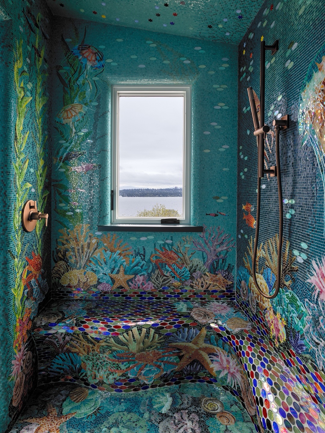 Interior of the completed mosaic shower enclosure — full walls, ceiling, and floor depicting a Pacific Northwest underwater scene